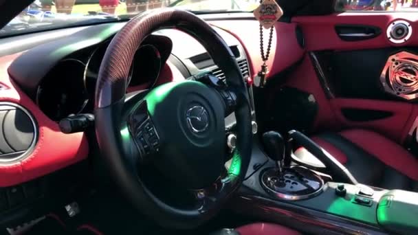 Cross hanging inside luxury car — Stock Video