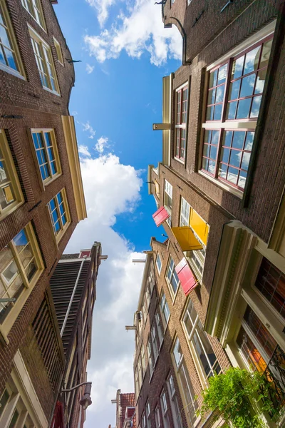 Facades of houses in old city in Amsterdam — Stock Photo, Image