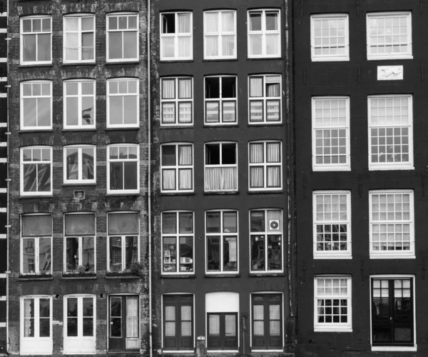 Facades of houses in old city in Amsterdam — Stock Photo, Image