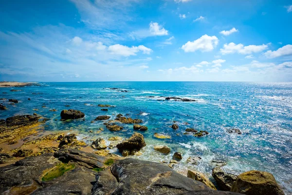 Sunset on rocky shore — Stock Photo, Image