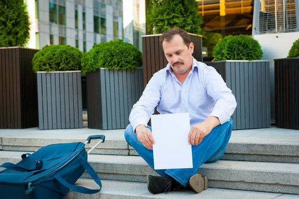 Sad businessman sitting on the steps — Stock Photo, Image