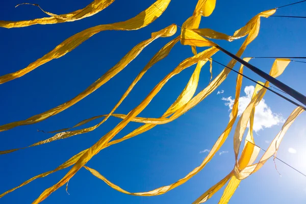 Yellow ribbon flags fluttering — Stock Photo, Image