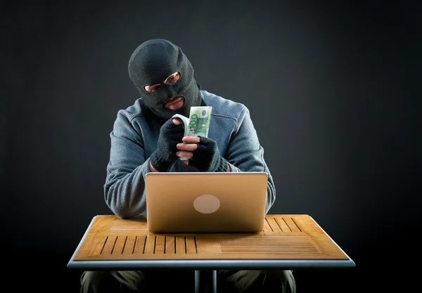 Cybercriminal man counts euro — Stock Photo, Image