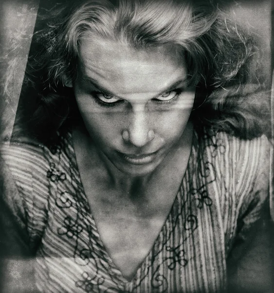 Vintage portrait of scary woman with evil face — Stock Photo, Image