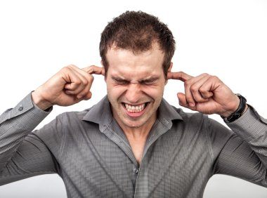 Too much noise concept - man covering ears with fingers clipart