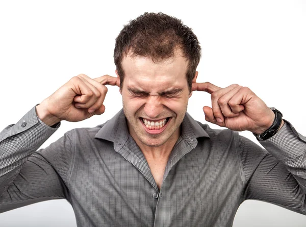 Too much noise concept - man covering ears with fingers — Stock Photo, Image