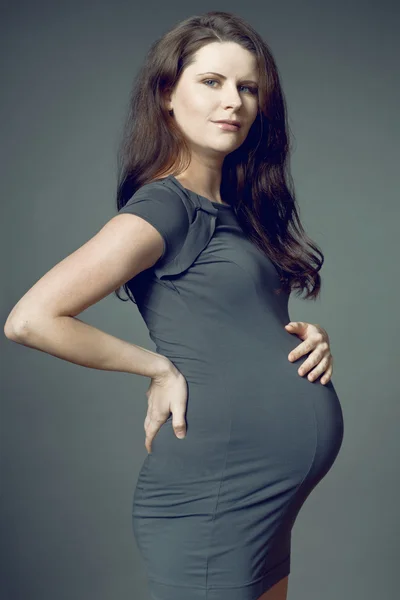 Expecting mother with long dark hair. — Stock Photo, Image