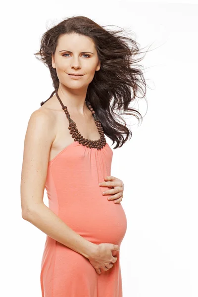 Pregnant woman with long dark hair. — Stock Photo, Image