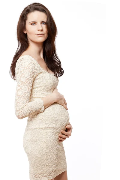 Těhotná žena s dlouhými tmavými vlasy. — Stock fotografie