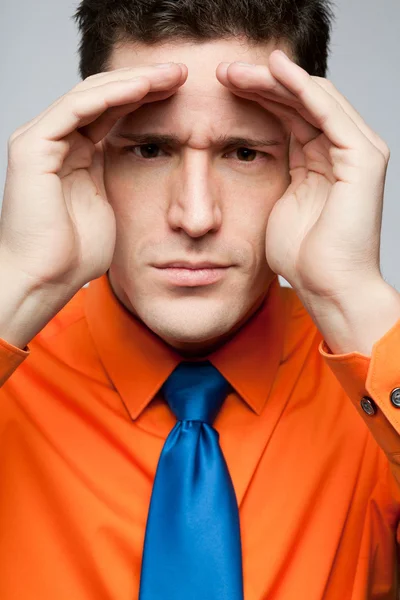 Happy man in orange shirt and blue tie. — Stock Photo, Image