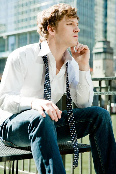 Handsome man in while shirt relaxing. — Stock Photo, Image