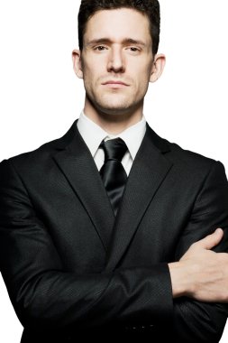 İşadamı emin poz ayakta. İzole.