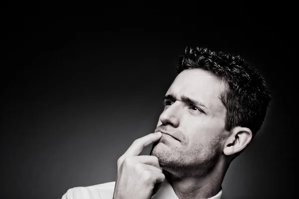 Young confident man solving a problem. — Stock Photo, Image