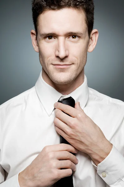 Young businessman in white shirt in confident pose. — Stock Photo, Image