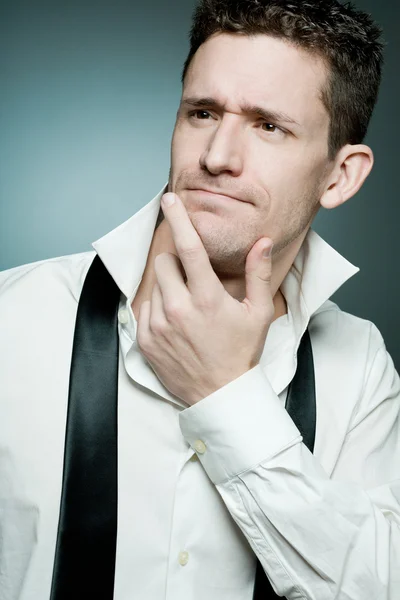 Young man in white shirt thinking of the great idea. — Stock Photo, Image