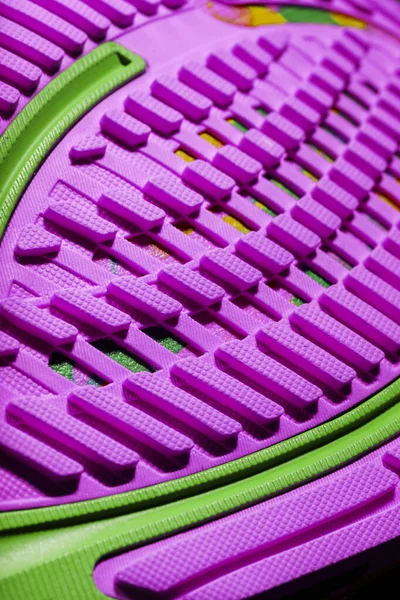 Pink sole tread with sports sneakers for jogging and fitness. Sports style, close-up