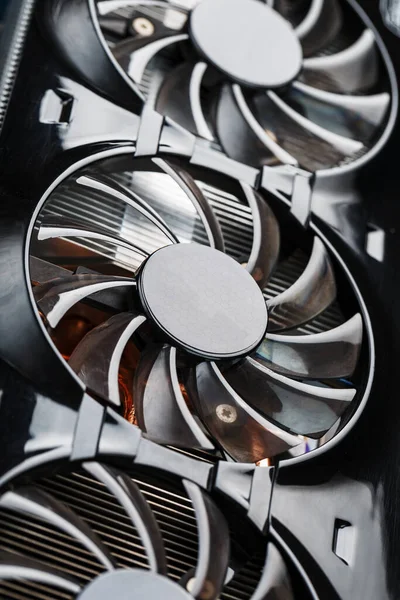 A video card with three fans is hardly a powerful cooling system. Video chip for gaming and cryptocurrency mining. Dark key