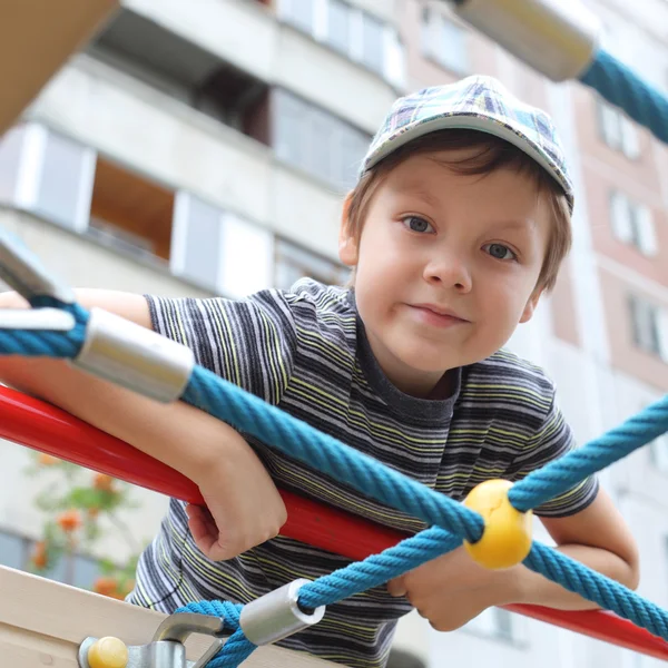 Boy playing outdoors — Stock Photo, Image