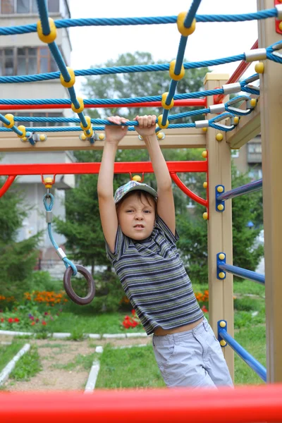 Boy playing outdoors — Stock Photo, Image