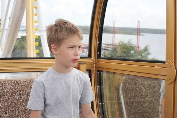 Boy in the ferris wheel cabin — Stock Photo, Image