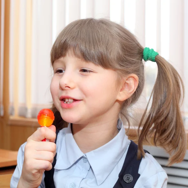 Little girl with the candy — Stock Photo, Image