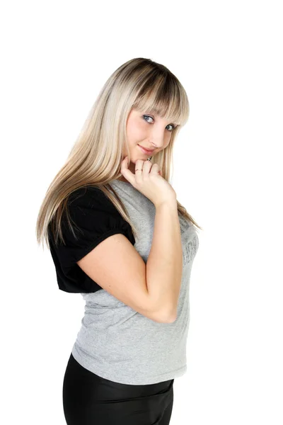 Sly blond girl standing in studio — Stock Photo, Image