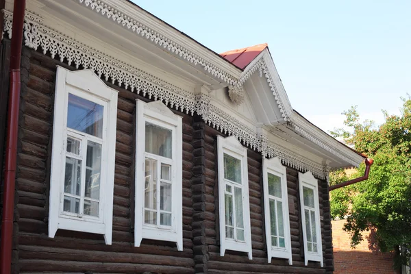 Wooden house with carved windows — Stock Photo, Image