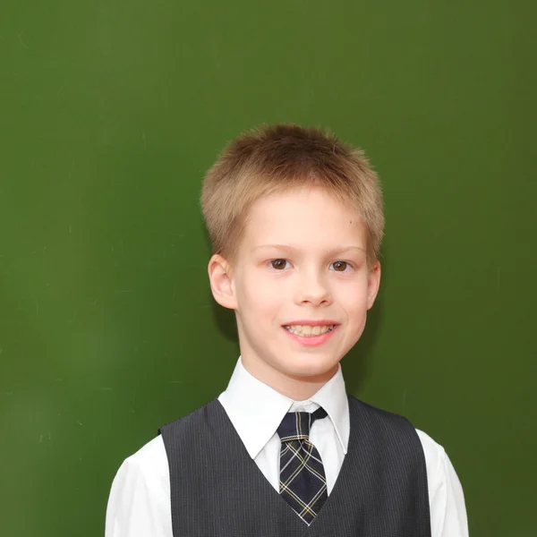 Boy near the blackboard — Stock Photo, Image