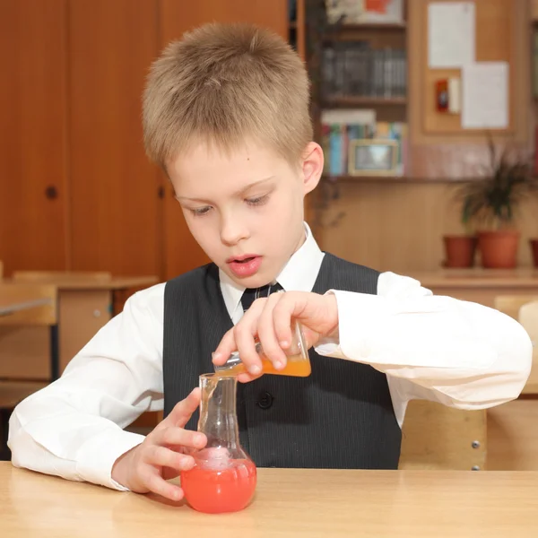 Boy with the pink chemical agent tubes — Stock Photo, Image