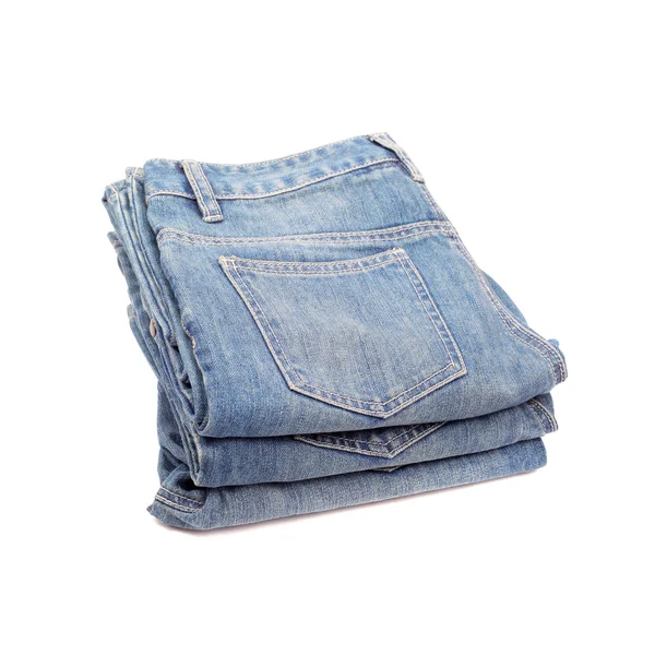 Several jeans on white — Stock Photo, Image