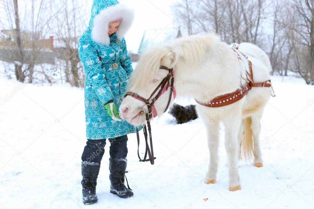 Child with the little horse