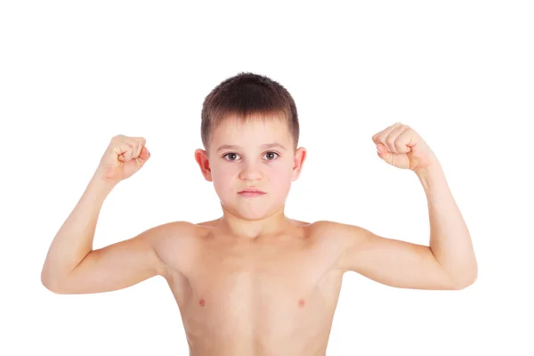 Chlapec prokazující jeho svaly — Stock fotografie