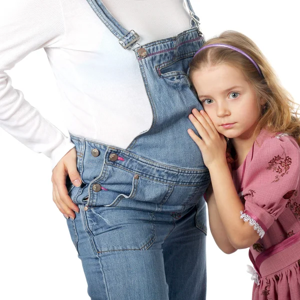 Child listening to her pregnant mother's belly — Stock Photo, Image