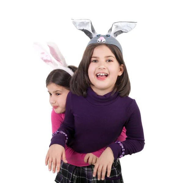 Twin sisters in carnival hare ears — Stock Photo, Image