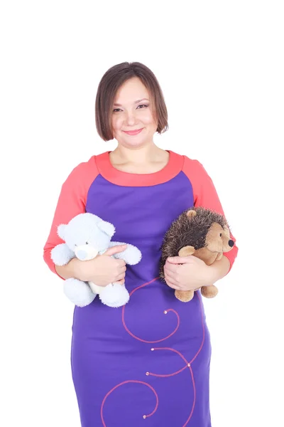 Jovem mulher com os brinquedos — Fotografia de Stock