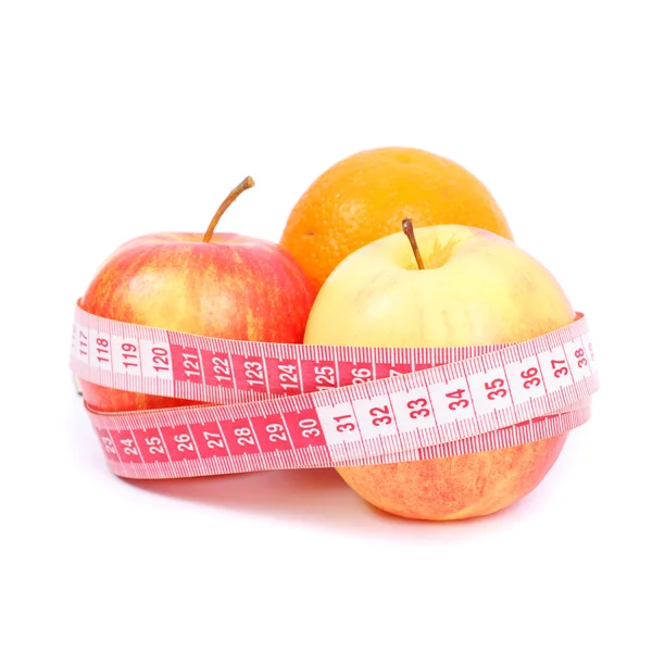 Apples and orange with measuring tape — Stock Photo, Image