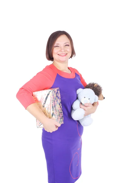 Pretty young woman with toys — Stock Photo, Image