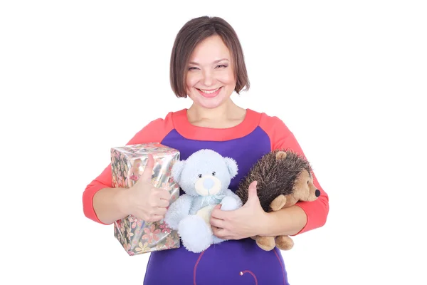 Pretty young woman with soft toys — Stock Photo, Image