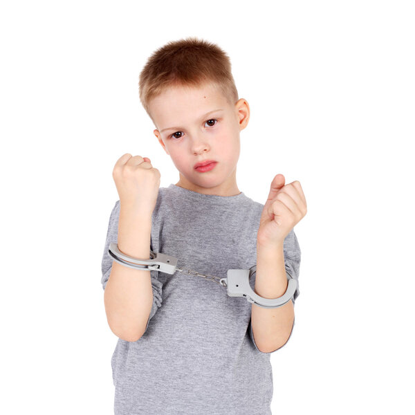 little boy with hand cuffs