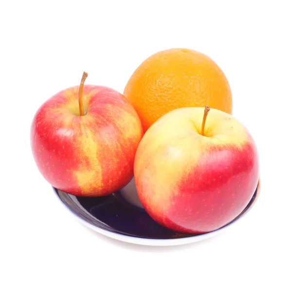 Яскраві фрукти на тарілці — стокове фото