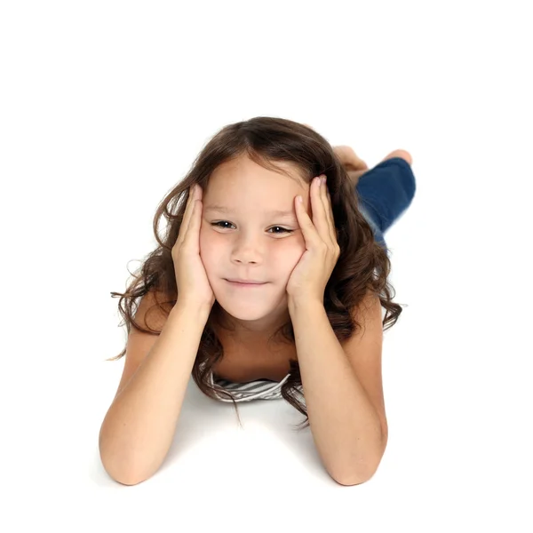 Cute preschooler girl lying Stock Image