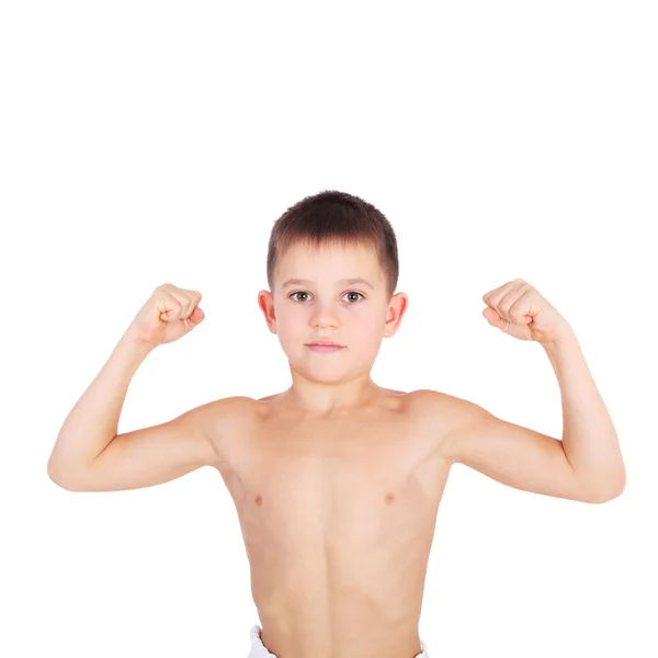 Liten pojke visar hans muskler — Stockfoto