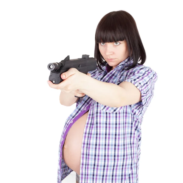 Pregnant woman with pistol — Stock Photo, Image