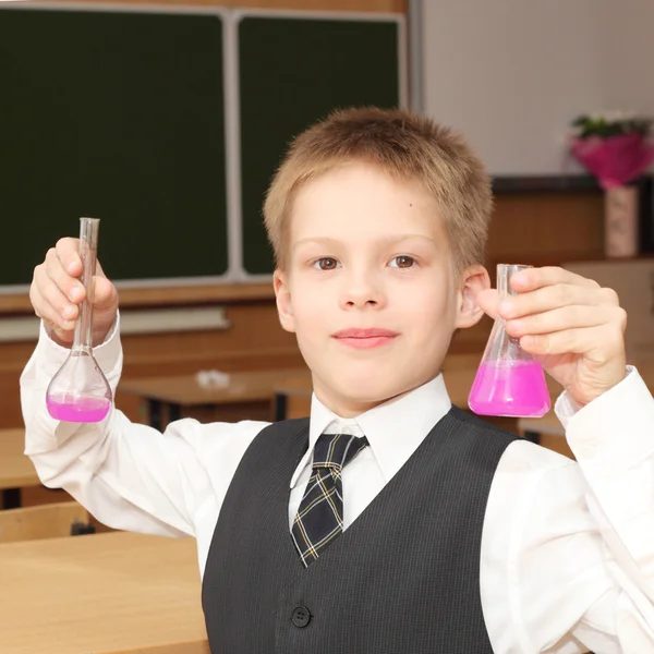 Little boy with chemical tubes — Stock Photo, Image