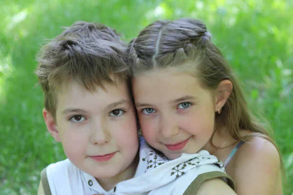 Pretty girl embracing handsome boy — Stock Photo, Image