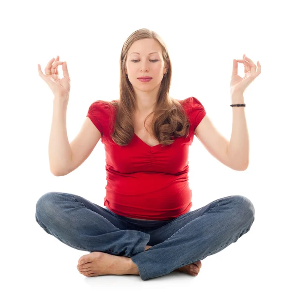 Jonge zwangere vrouw het beoefenen van yoga — Stockfoto