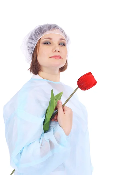 Unga läkare med röd blomma — Stockfoto