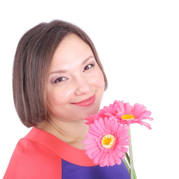 Hübsche junge Frau mit Blumen — Stockfoto