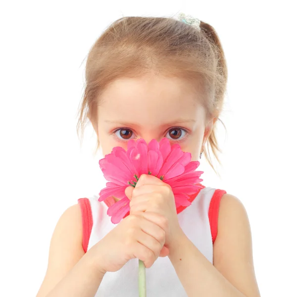 Μικρό κορίτσι μυρίζοντας μεγάλο λουλούδι — Φωτογραφία Αρχείου