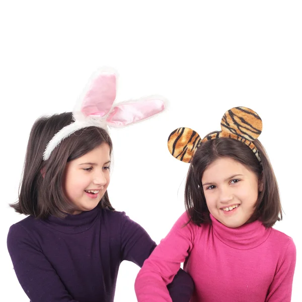 Twin sisters in hare and tiger ears — Stock Photo, Image